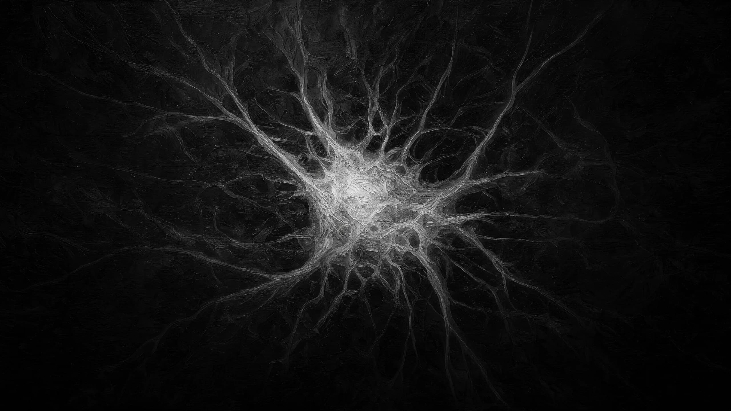 A single luminous neuron with branching dendrites against a black background.